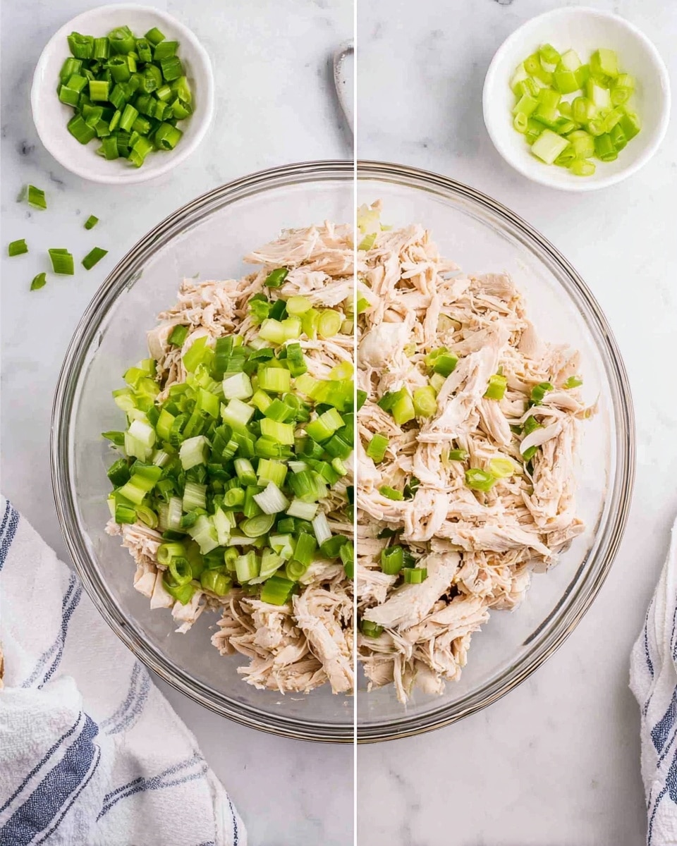 A clear glass bowl sits on a white marbled surface filled with shredded pale beige chicken pieces as the base layer, mixed with bright green chopped celery and darker green sliced scallions on top. Two small white bowls with a few pieces of celery and scallions are placed near the top edge. On the left side of the image, more chopped celery and scallions sit on the chicken, while on the right side, the chicken and veggies are mixed together. A white and blue striped cloth is partially visible near the bottom left corner. Photo taken with an iphone --ar 4:5 --v 7