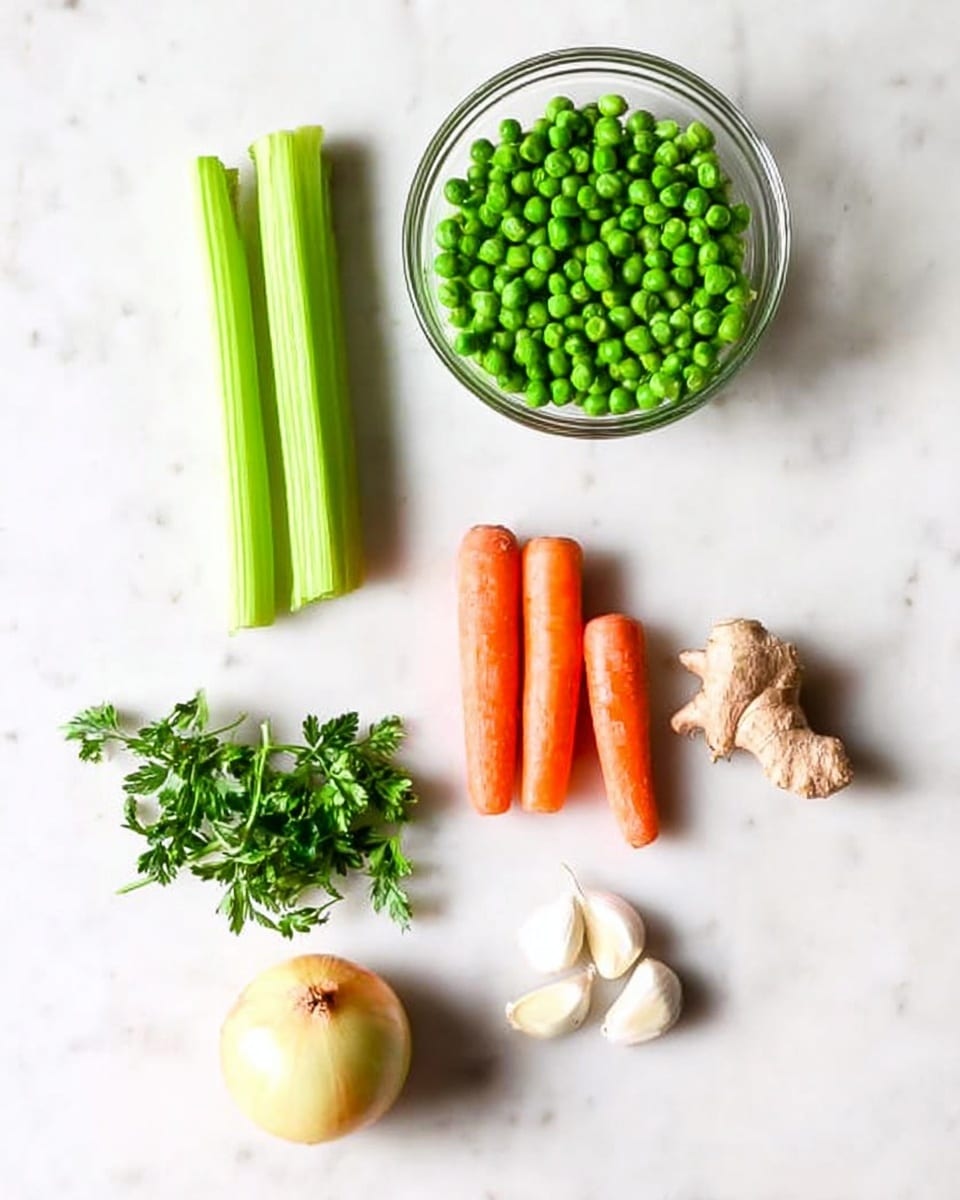 The image shows fresh vegetables and herbs neatly arranged on a white marbled surface. At the top center, there is a clear glass bowl filled with bright green peas. To the left of the bowl, two light green celery sticks lie vertically. Below the bowl, three small orange carrots are placed side by side horizontally. To the left of the carrots, there is a small bunch of green parsley with vibrant leaves. Further left, a round yellow onion sits near the bottom edge of the image. At the bottom center near the onion, two white garlic cloves are positioned next to each other. On the right side of the garlic, a light brown piece of ginger with its rough texture is shown. The overall image is clean and bright with a simple layout. photo taken with an iphone --ar 4:5 --v 7