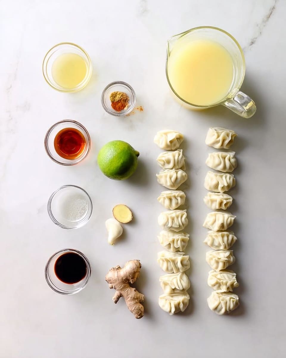 The image shows ingredients neatly placed on a white marbled surface. On the right side, there are two neat rows of raw dumplings with a pale off-white dough color and soft, folded textures. To the left, there are small glass bowls with different sauces and seasoning, one with a light yellow liquid, another with a dark brown sauce, and one with a reddish paste. A small whole lime with green skin is positioned near the middle. Below the lime are three cloves of garlic and a small piece of ginger with light brown skin. Above everything is a larger glass pitcher filled with light yellow broth. The arrangement is clean and simple, with each ingredient spaced out evenly, creating a balanced visual. photo taken with an iphone --ar 4:5 --v 7