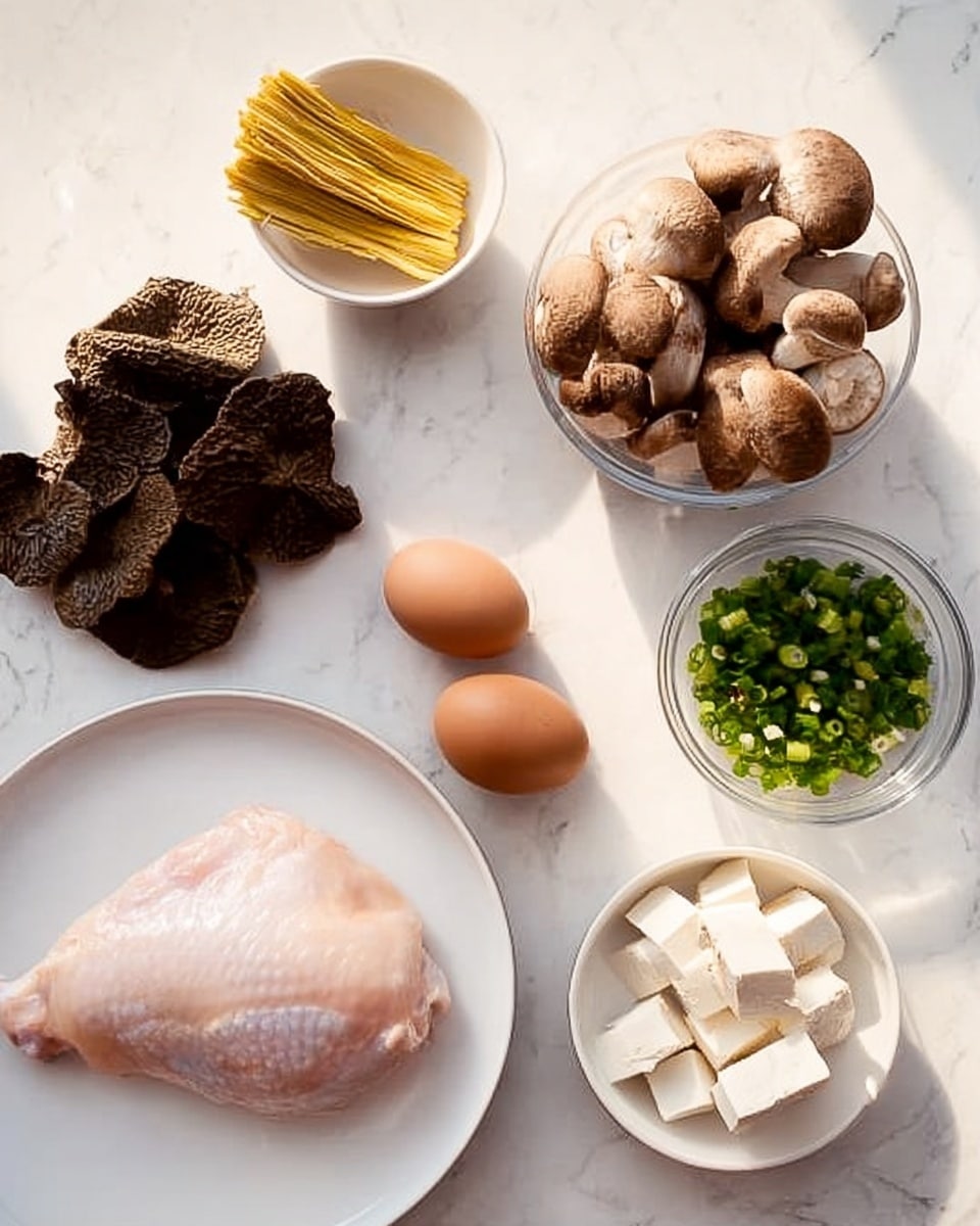 A white plate holds a single raw chicken piece, light pink in color and smooth in texture, placed on a white marbled surface. Near the plate, two brown eggs with smooth shells sit side by side. To the top left, thin yellow strips of bamboo shoots rest on a small white bowl. To the top center, a cluster of dark brown, wrinkled wood ear mushrooms lies directly on the marbled surface. A clear glass bowl in the center contains round, brown shiitake mushrooms with textured caps. To the top right, a white bowl is filled with white, firm tofu cubes, and below that, another white bowl contains small chopped green onions, bright green and fresh. The whole scene is lit naturally, highlighting the colors and textures clearly photo taken with an iphone --ar 4:5 --v 7