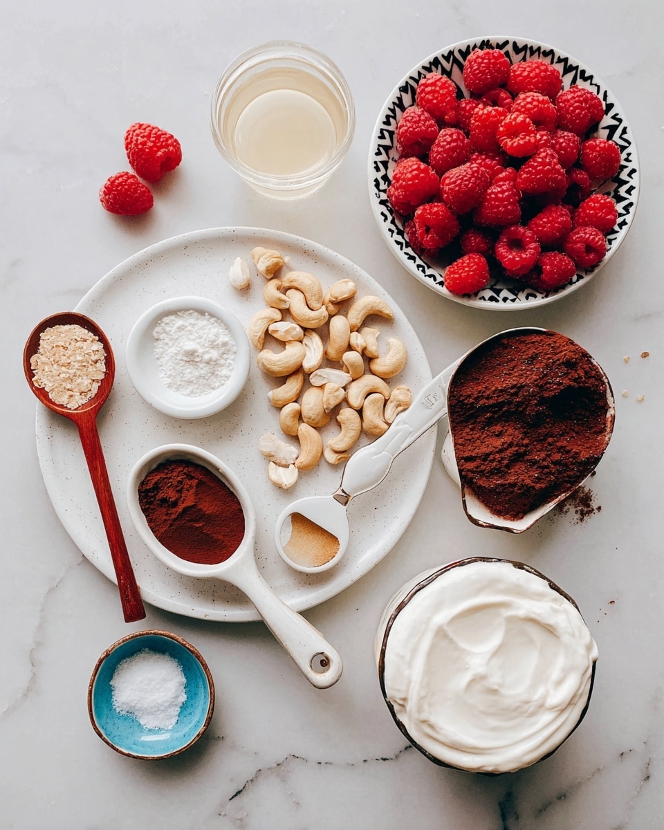 A white round plate holds several ingredients arranged neatly; on the plate, there is a small white bowl filled with light brown cashew nuts, another small white bowl with a fine beige powder, a white spoon with salt, a wooden spoon with a white solid ingredient, a white spoon with brown liquid, and a wooden spoon heaped with dark brown powder. Surrounding the plate on the white marbled surface are two bright red raspberries, a small blue dish with white powder, a small cup of pale yellow liquid, a clear glass of white liquid, a round bowl with smooth white cream, and a black and white zigzag patterned bowl filled with many red raspberries. Photo taken with an iphone --ar 4:5 --v 7