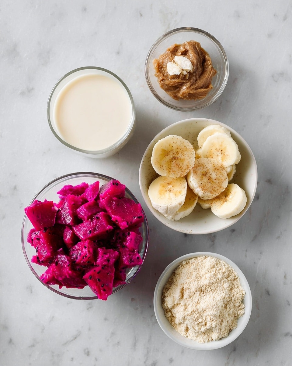 The image shows five small white bowls and a glass with different ingredients arranged on a white marbled surface. At the bottom left, there is a bowl filled with bright magenta pieces of diced dragon fruit. On the bottom right is a bowl filled with light beige powder. Above that, slightly to the right, another glass bowl holds several slices of yellow banana topped with a small sprinkle of brown sugar. Above the banana, a small bowl contains a thick, light brown paste. To the left of the paste, there is a clear glass filled with creamy white liquid. All containers are simple and white, placed neatly on the white marbled surface, with soft natural light and minimal shadows visible. photo taken with an iphone --ar 4:5 --v 7
