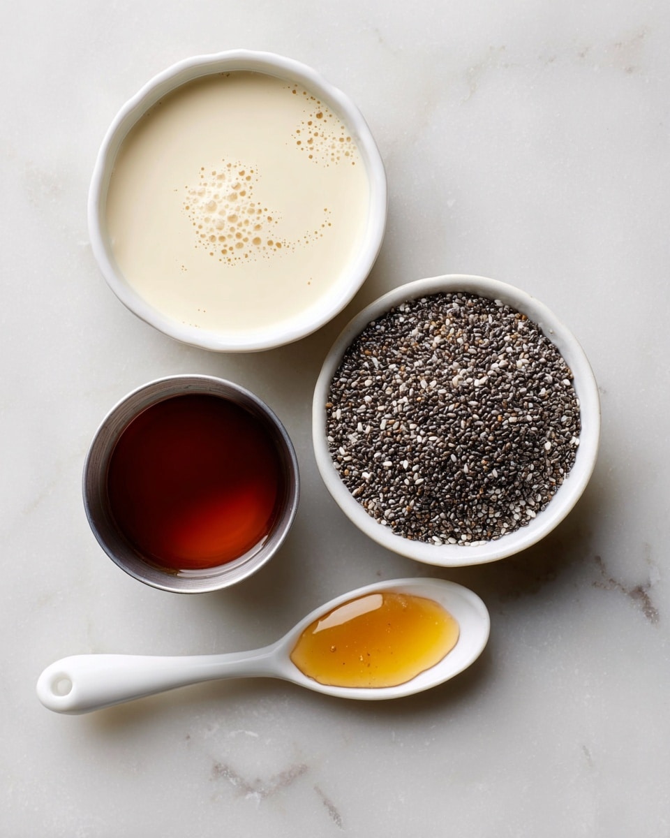 The image shows four small containers arranged on a white marbled surface. At the top left, there is a white bowl filled with a creamy light beige liquid, smooth with tiny bubbles on the surface. To its right, a white bowl contains many small black and white chia seeds, tightly packed and textured. Below the creamy liquid, a small stainless steel cup holds a dark amber liquid, clear and shiny. At the bottom, a white ceramic spoon with a curved handle holds a small amount of a darker golden liquid, glossy and thick. photo taken with an iphone --ar 4:5 --v 7